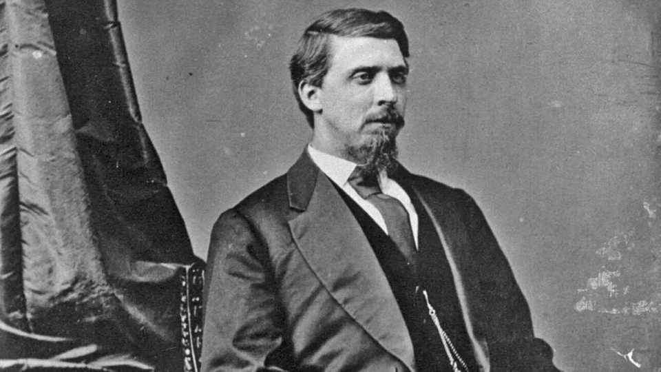 Historische Fotografie zeigt Isaac Charles Parker im Sessel
